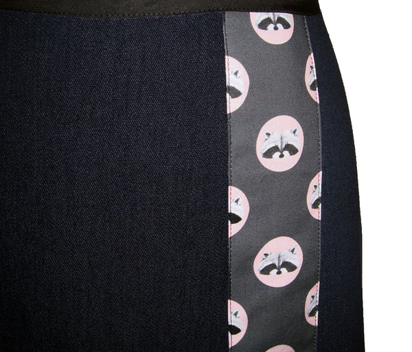 dark denim knee length skirt with polka dots and raccoon face print.