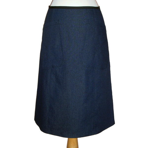 denim midi skirt in blue, with large patch pockets on the front, 70's style.